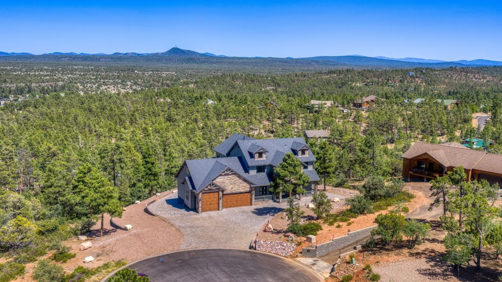 Aerial view of The Lazy Bear Way luxury vacation rental in Show Low, AZ surrounded by pine trees