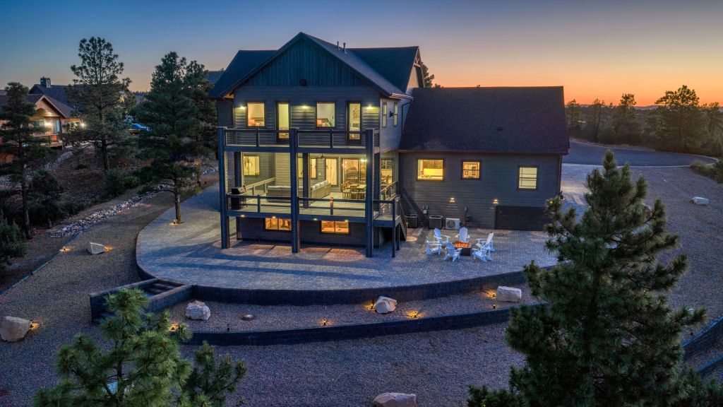Aerial view of The Lazy Bear Way luxury vacation rental in Show Low, AZ surrounded by pine trees