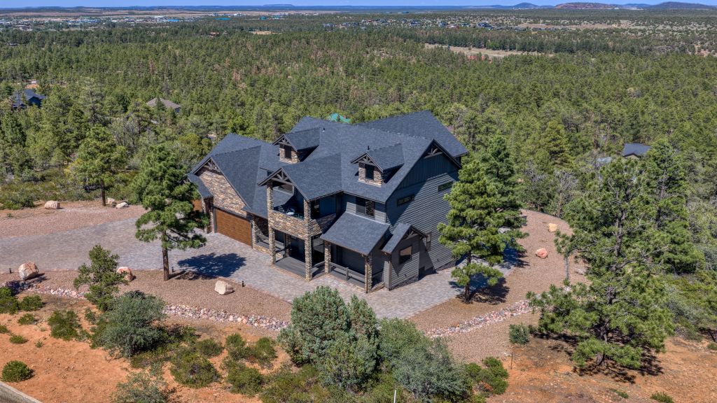 Aerial view of The Lazy Bear Way luxury vacation rental in Show Low, AZ surrounded by pine trees