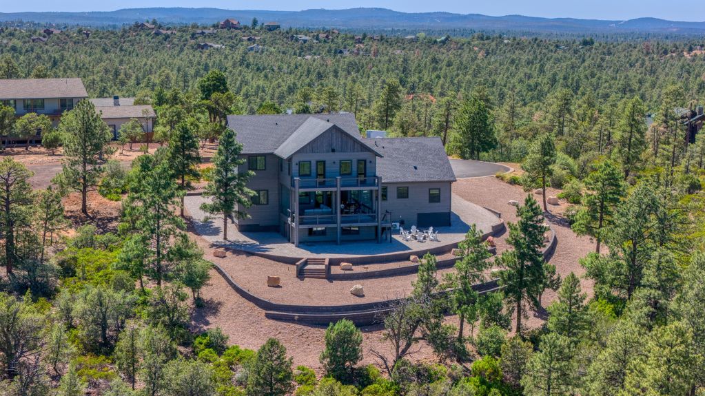 Aerial view of The Lazy Bear Way luxury vacation rental in Show Low, AZ surrounded by pine trees
